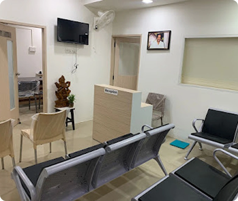 Clean and modern clinic waiting area with reception desk and patient seating.